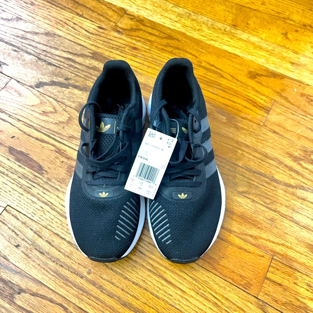 ADIDAS Brand New. Size 7. Black with gold accents